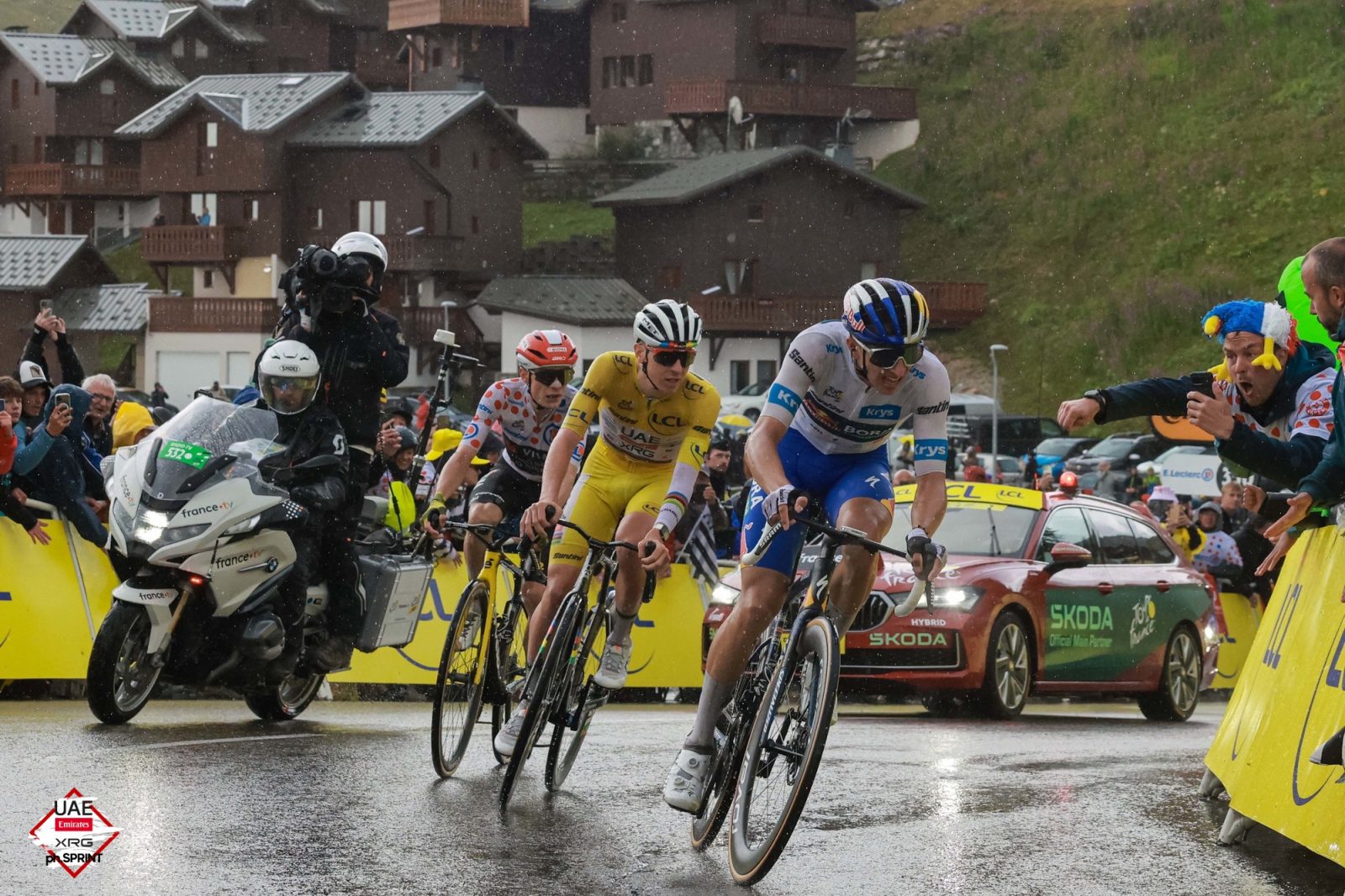 Tadej Pogačar nears the summit of La Plagne alongside his likely podium companions