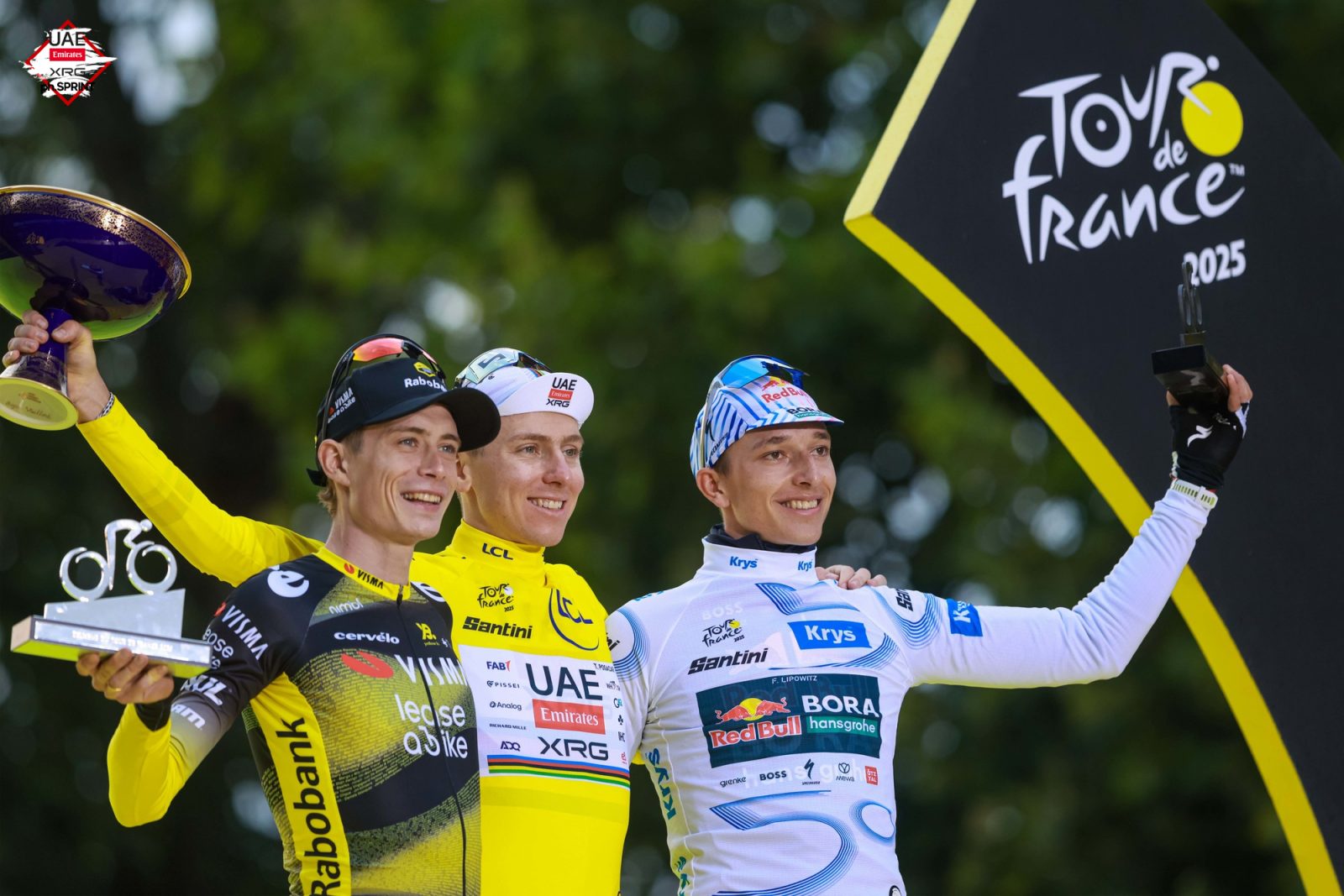 Pogačar stands alongside his final podium companions