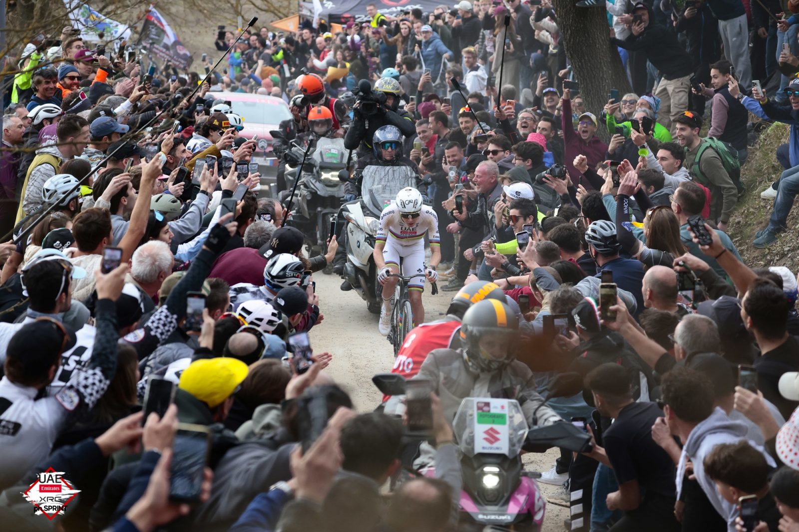 Pogačar was roared on by thousands of supporters at roadside in Tuscany
