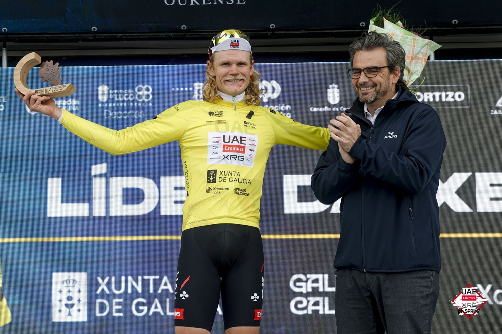 Johansen pulls on the leader's jersey at O Gran Camiño